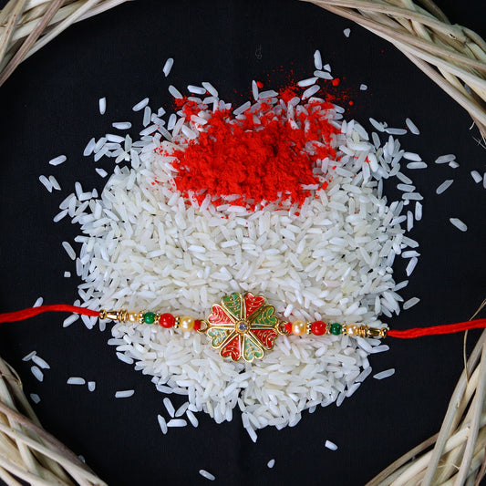 Traditional Rakhi With Bright Floral Centerpiece And Decorative Thread Wukusy