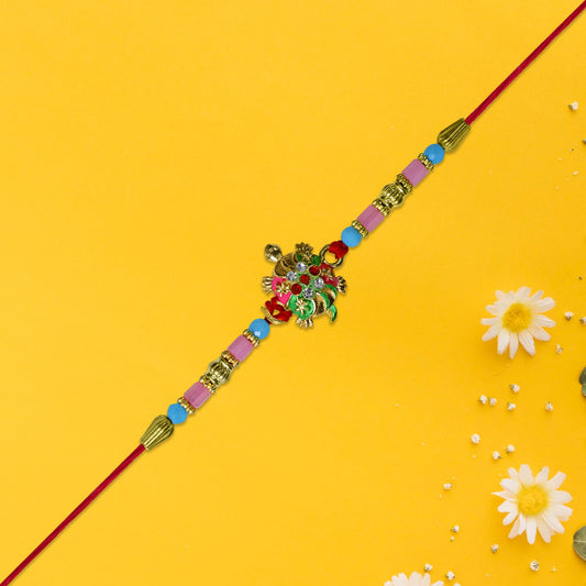 Turtle Design Rakhi With Floral Accents And Beads Wukusy