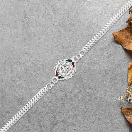 Stylish Rakhi With Intricate Floral Motif And Enamel Touches Wukusy