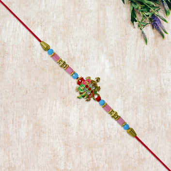 Turtle Design Rakhi With Floral Accents And Beads Wukusy