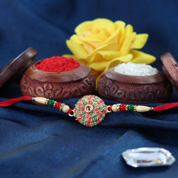 Traditional Kundan Rakhi With Golden Floral Base And Rudraksha Beads Wukusy