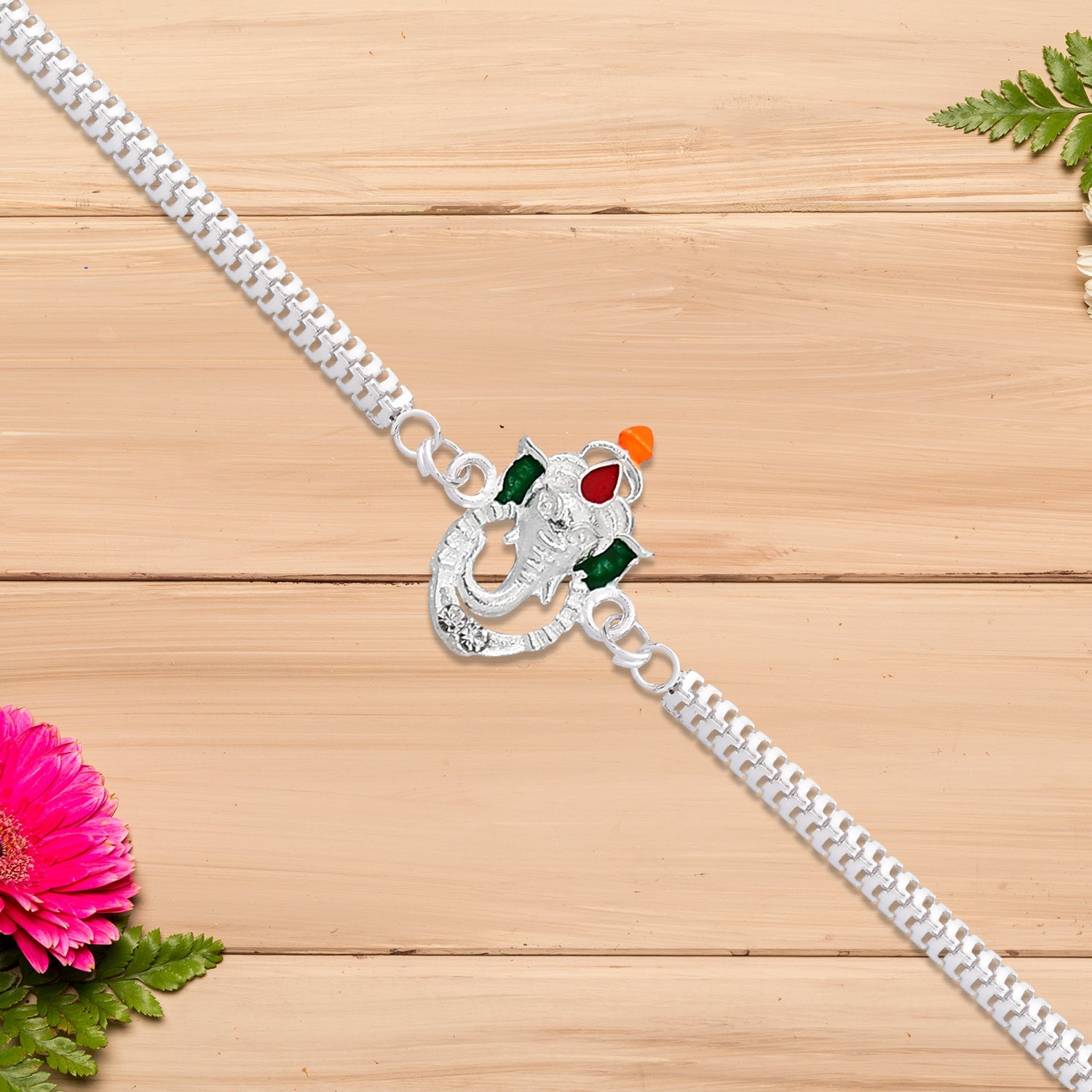 Stylish Ganesha Rakhi With Enamel Highlights And Silver Metal Chain Wukusy