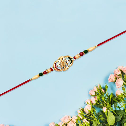 Traditional Oval Rakhi With Kundan Work And Red-green Beads Wukusy