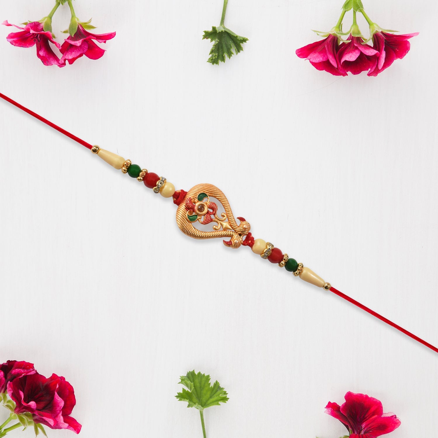Designer Rakhi With Veena And Flower Charm Wukusy