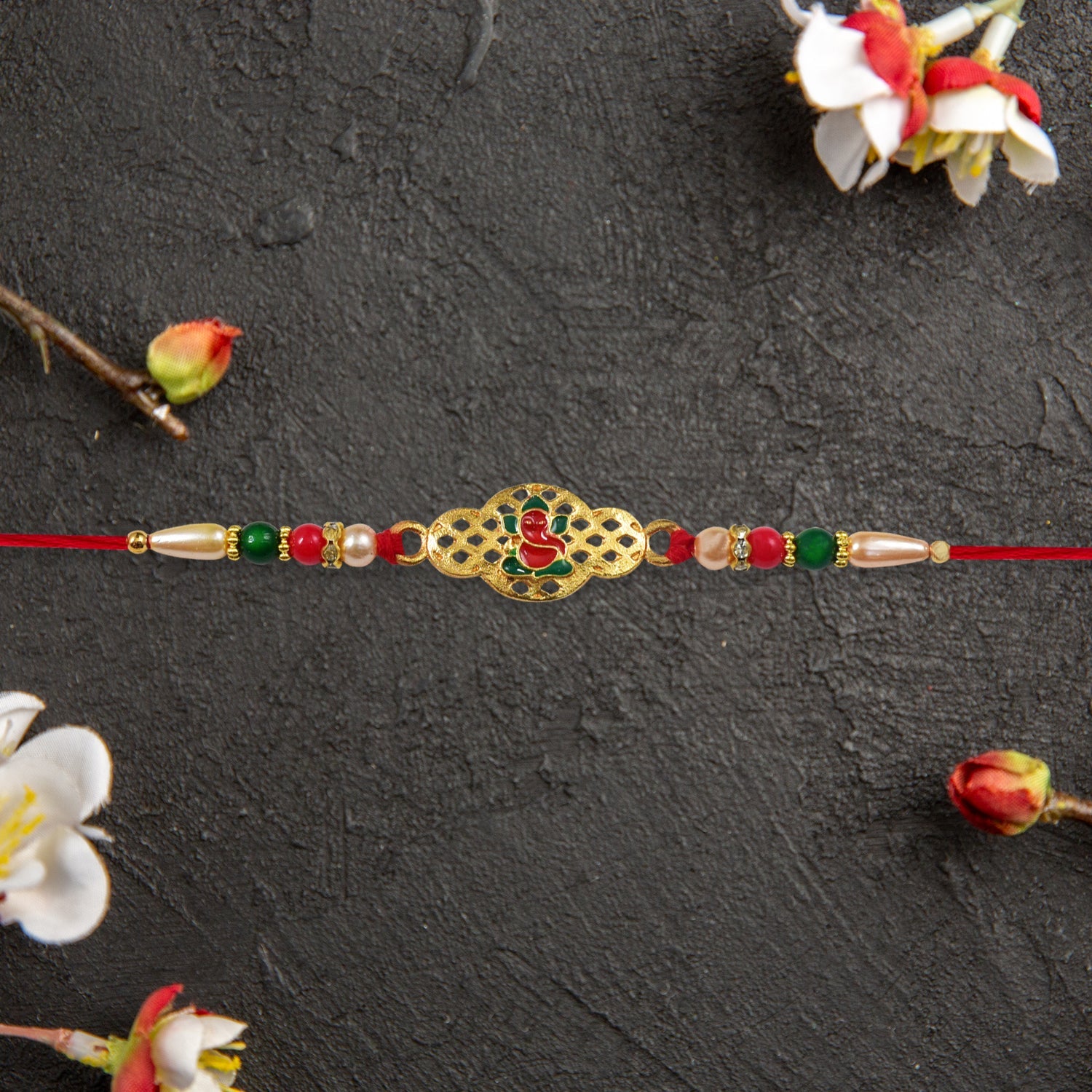 Religious Ganesha Rakhi In Gold Finish Wukusy