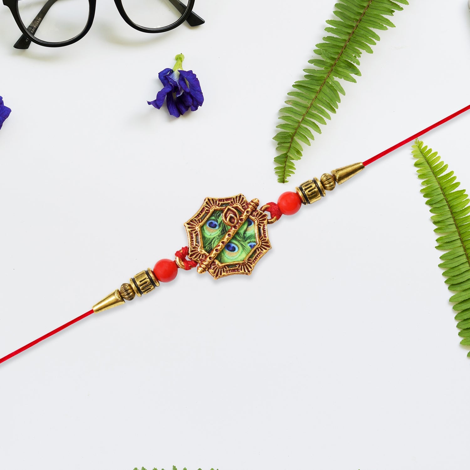 Silver Plated Floral Rakhi With Red  Green Stones Wukusy