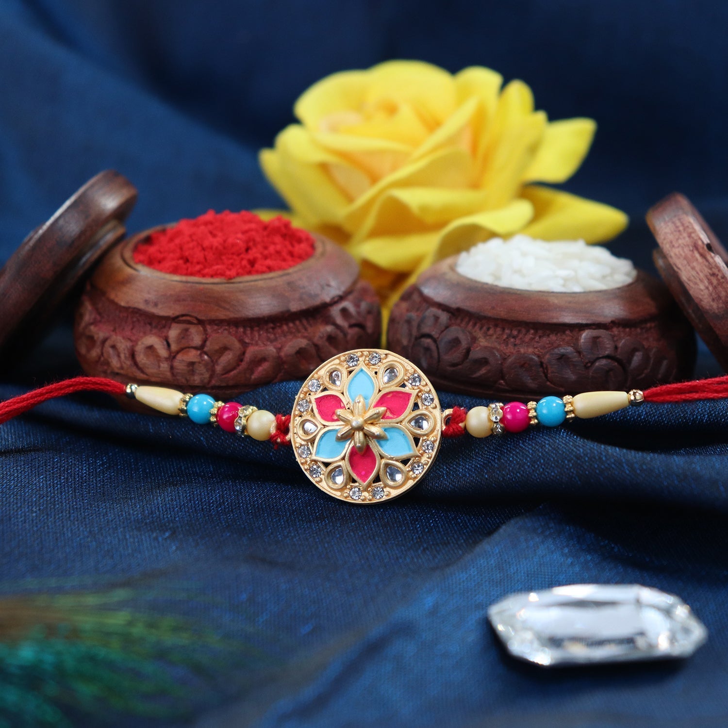 Round Floral Rakhi With Pink-blue Enamel And Beaded Thread Wukusy