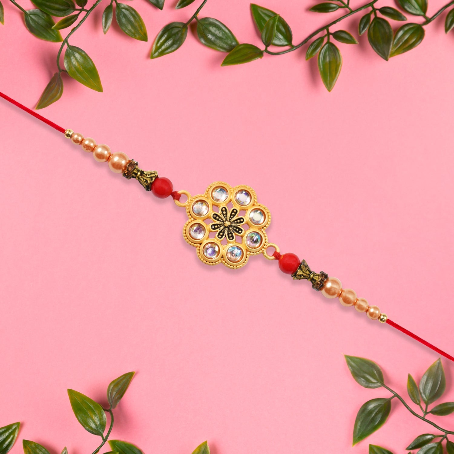 Gold-toned Floral Rakhi With Pink Stones Wukusy