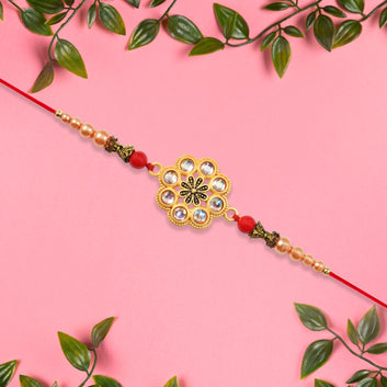 Gold-toned Floral Rakhi With Pink Stones