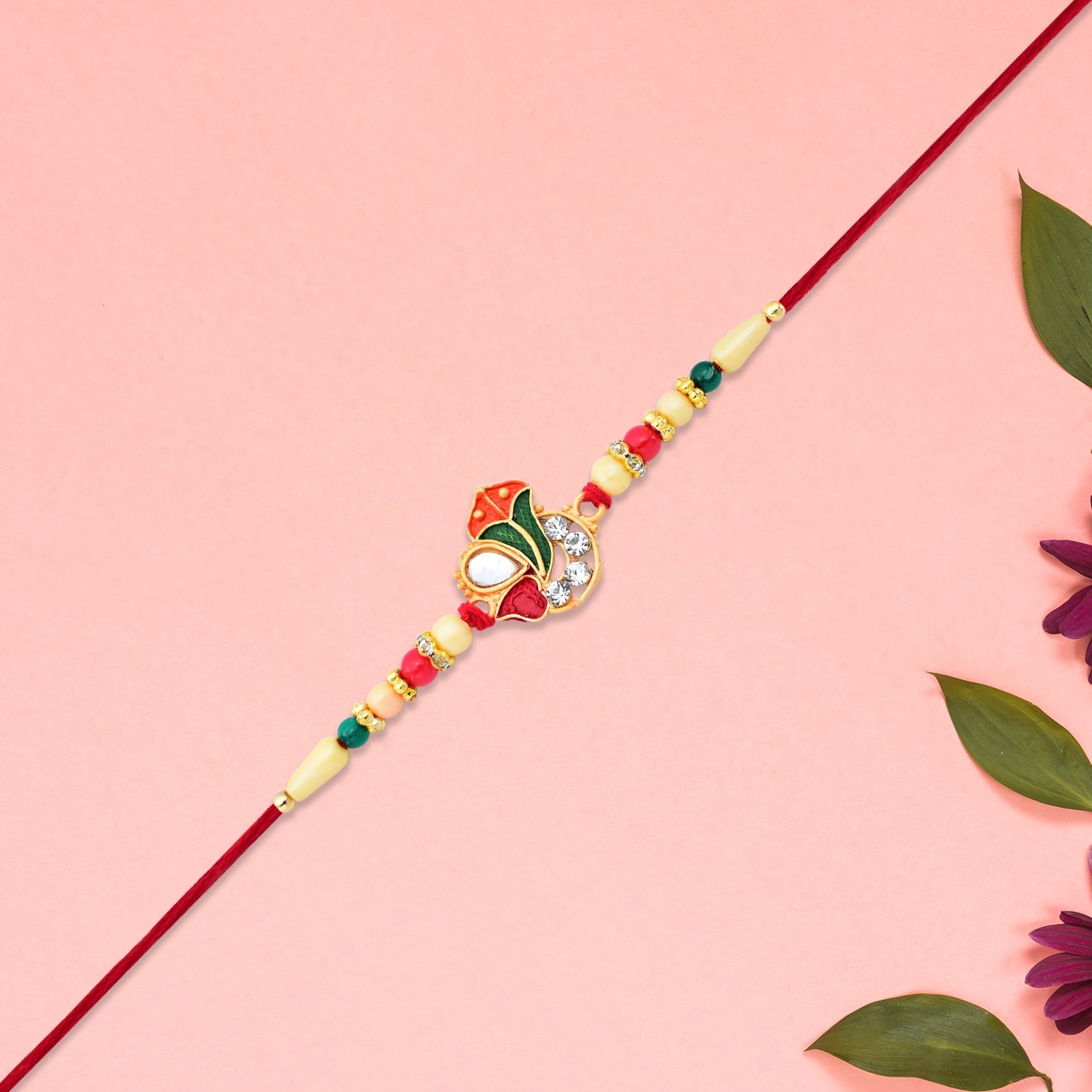 Divine Ganpati Rakhi With Enamel Work And Traditional Beads Wukusy