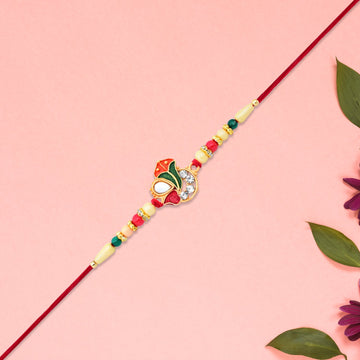 Divine Ganpati Rakhi With Enamel Work And Traditional Beads Wukusy