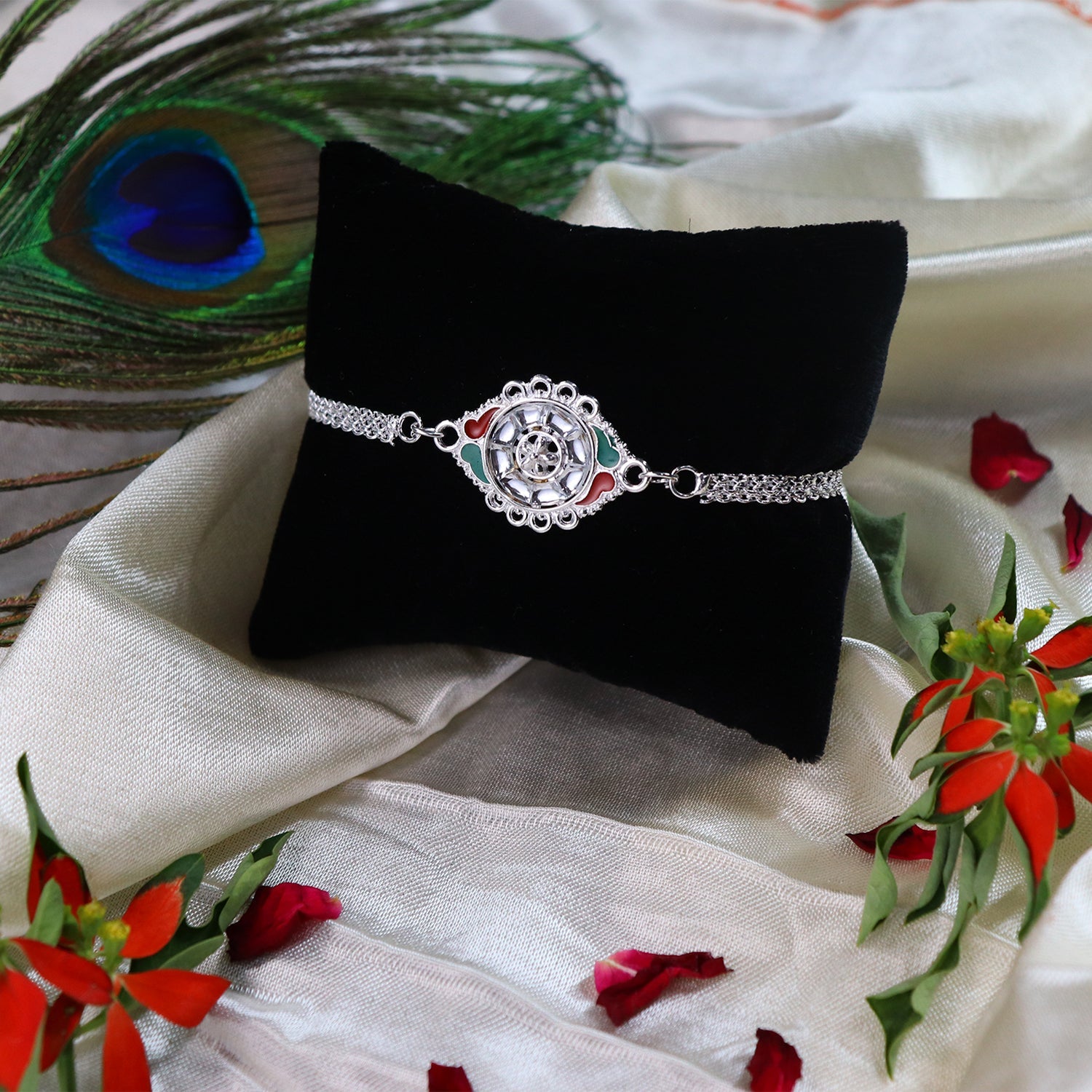 Stylish Rakhi With Intricate Floral Motif And Enamel Touches Wukusy