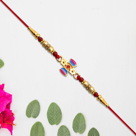 Damru Rakhi With Beads And Floral Detailing Wukusy