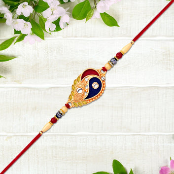Elegant Rakhi With Enamel Paisley Design And Gold-tone Embellishments