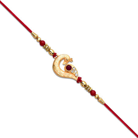 Golden Peacock Feather Rakhi With Red Thread And Kundan Detailing Wukusy