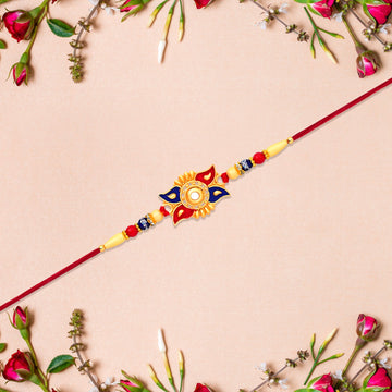 Designer Sun Motif Rakhi With Red And Blue Enamel Work Wukusy