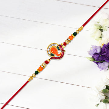 Golden Ganesha Rakhi With Red-green Beads And Stone Detailing Wukusy