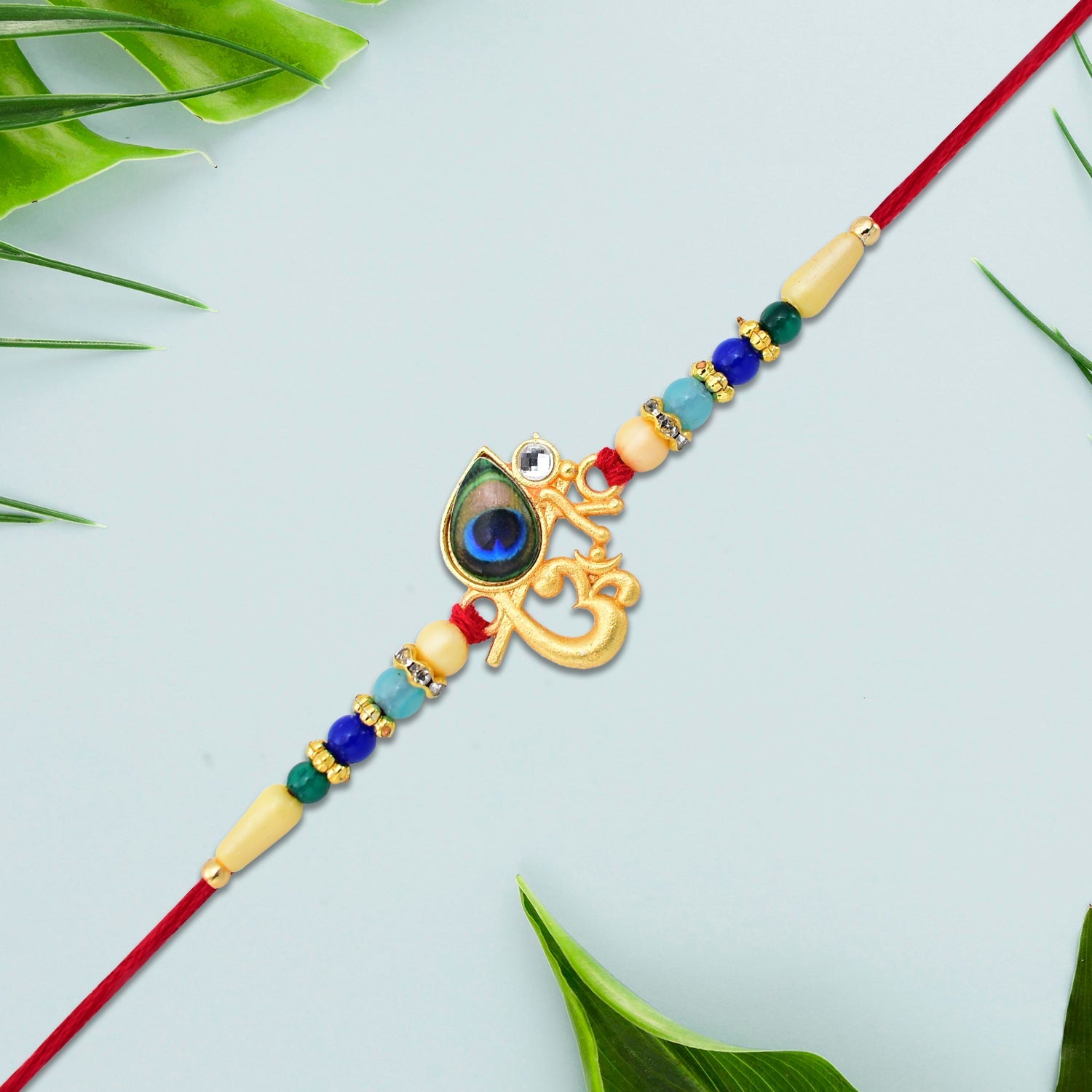 Divine Govind Rakhi With Peacock Feather Design And Multicolor Beads Wukusy