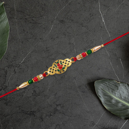 Religious Ganesha Rakhi In Gold Finish Wukusy