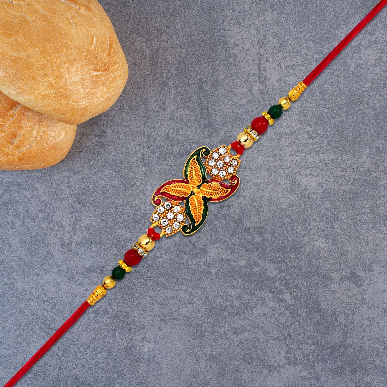 Elegant Red-green Bead Rakhi With Intricate Golden Flower Motif Wukusy