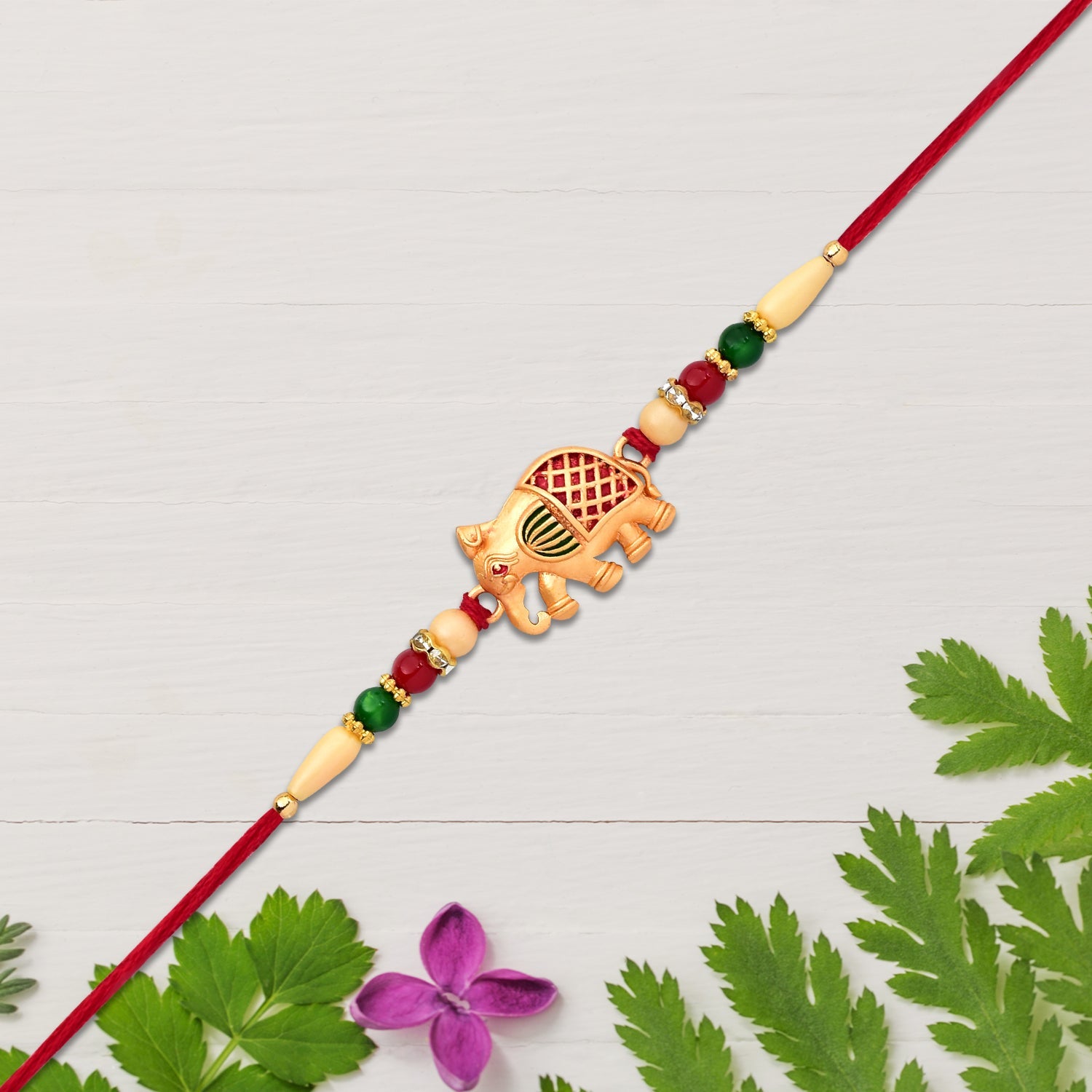 Golden Elephant Rakhi With Red Green Moti Wukusy