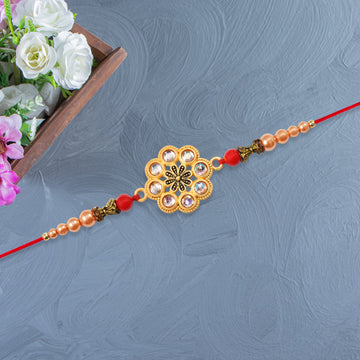Gold-toned Floral Rakhi With Pink Stones Wukusy