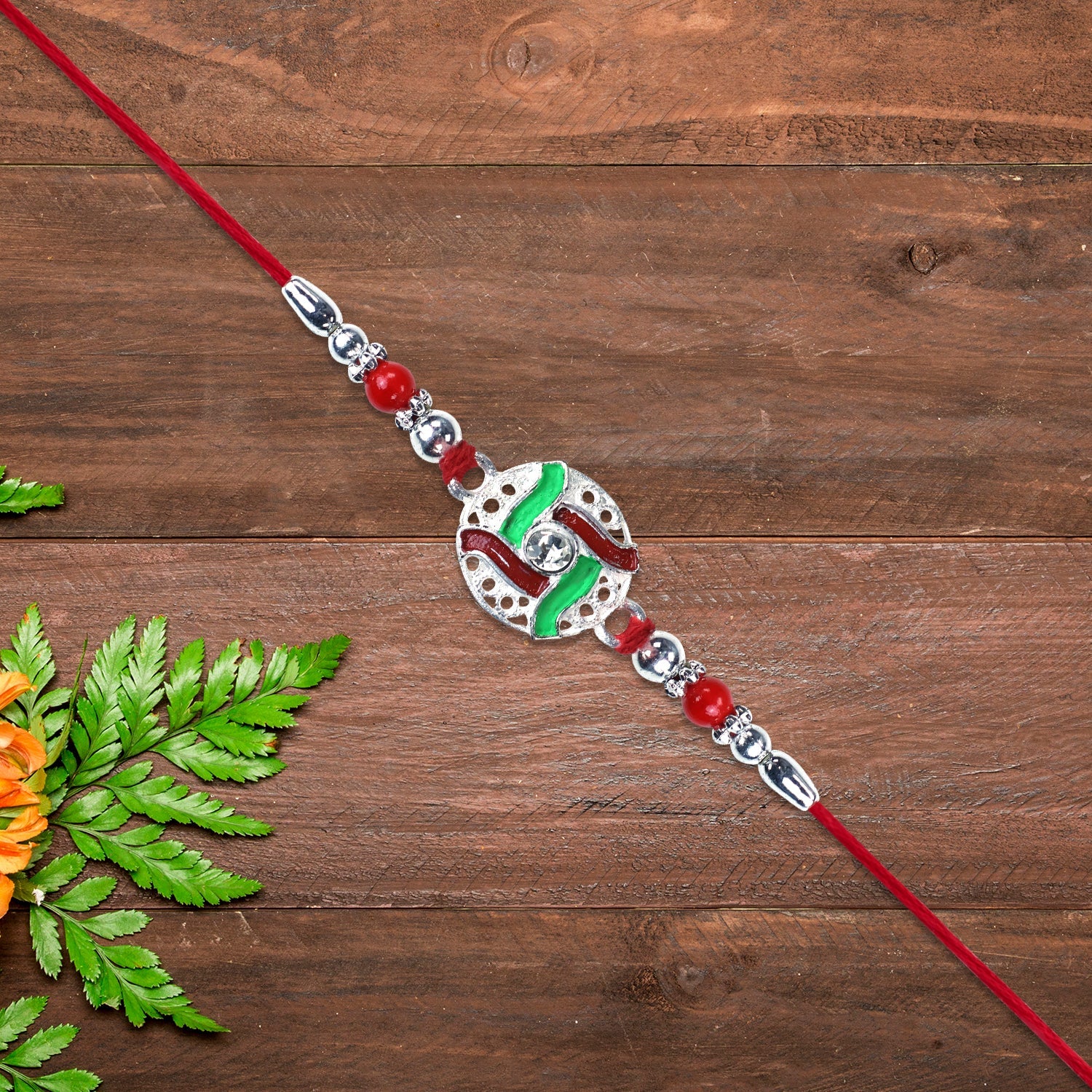 Silver-tone Swastik Rakhi Wukusy