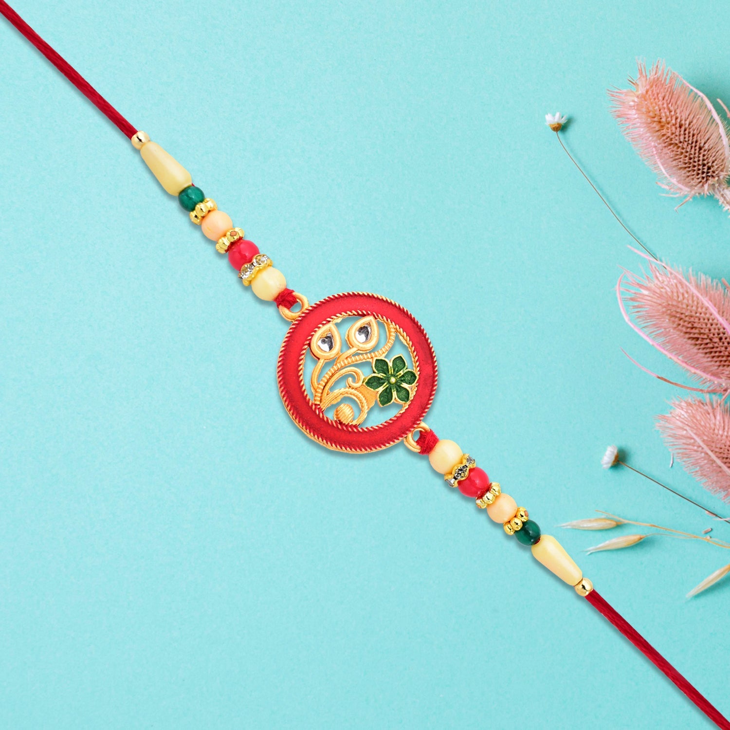 Round Designer Paisley Rakhi With Floral Charm Wukusy