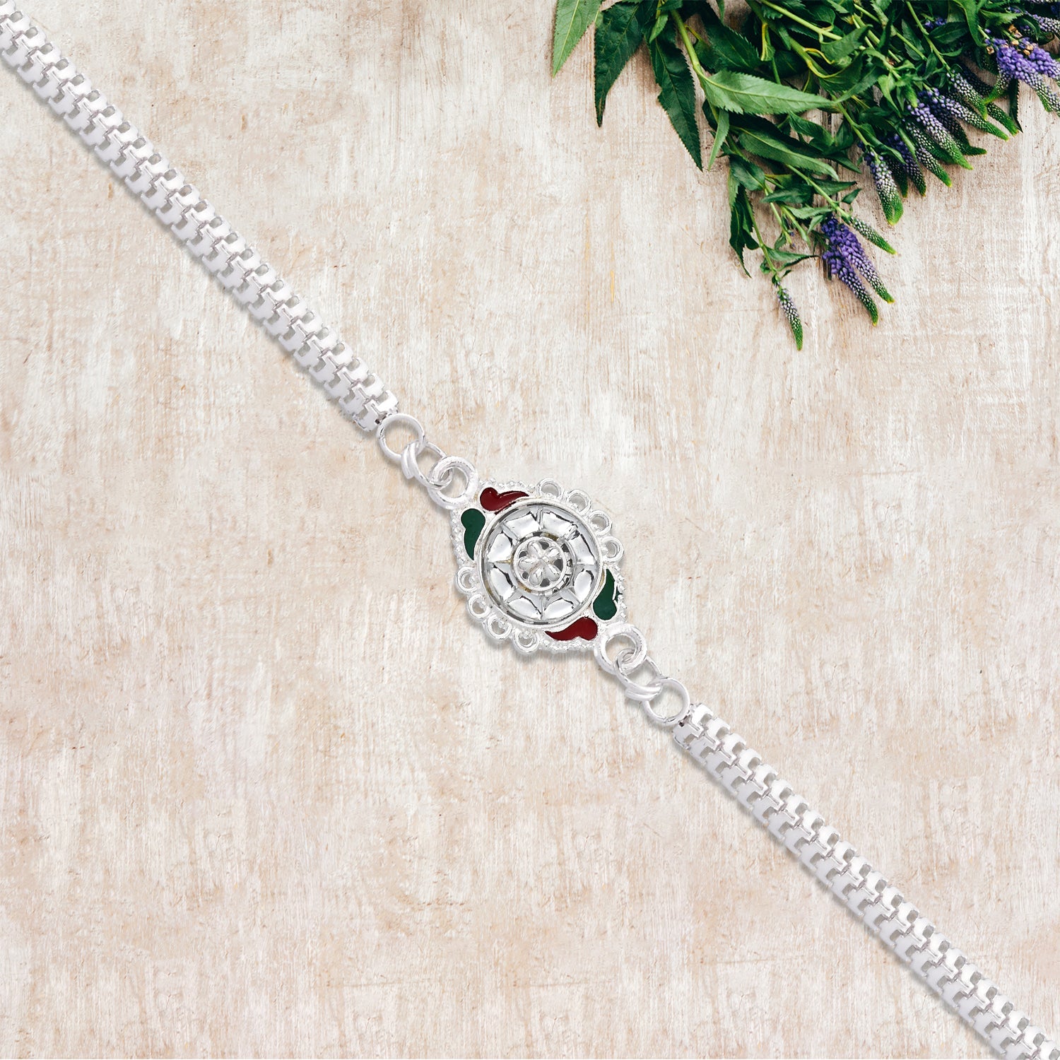 Stylish Rakhi With Intricate Floral Motif And Enamel Touches Wukusy