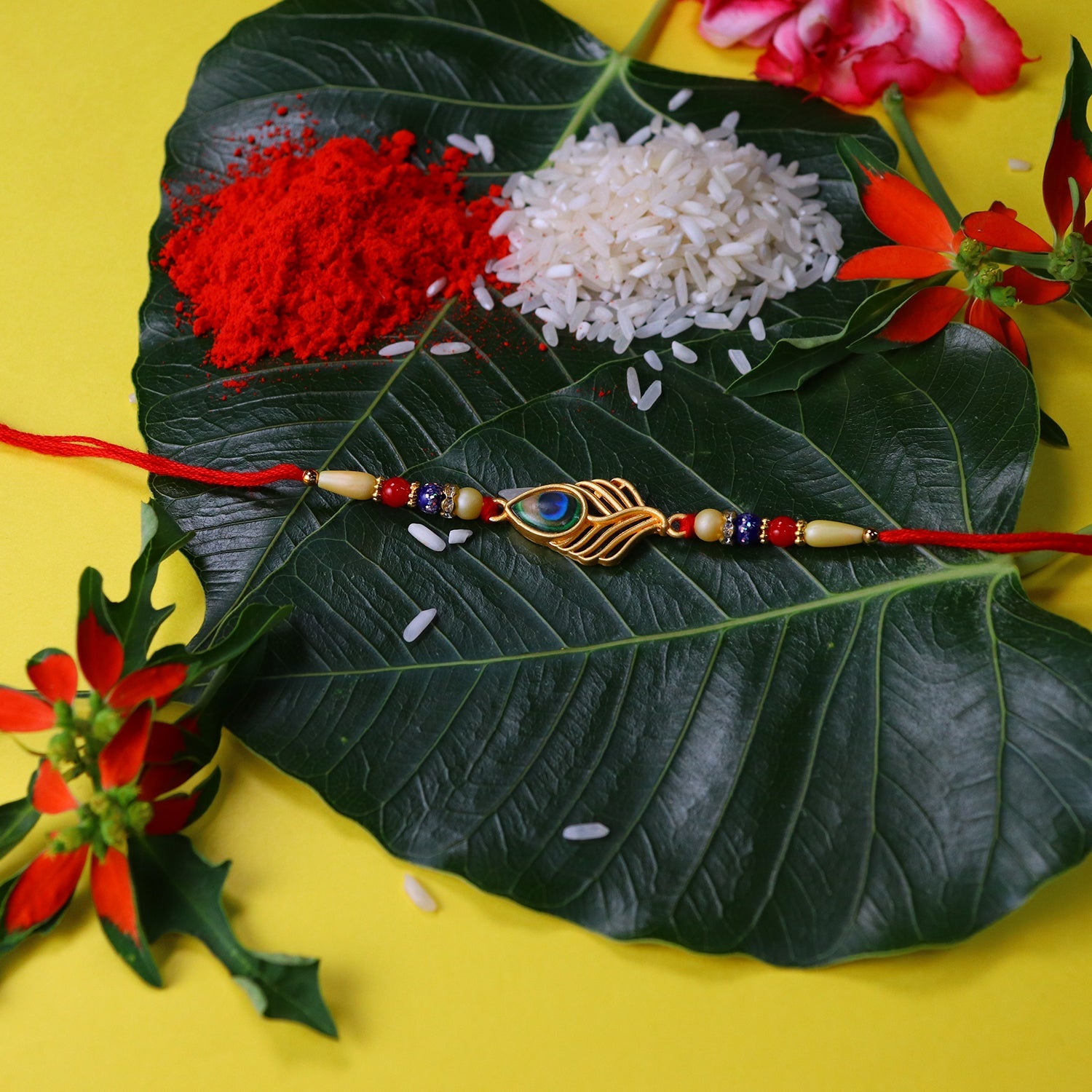 Peacock Feather Design Rakhi With Beaded Detailing And Red Thread Wukusy