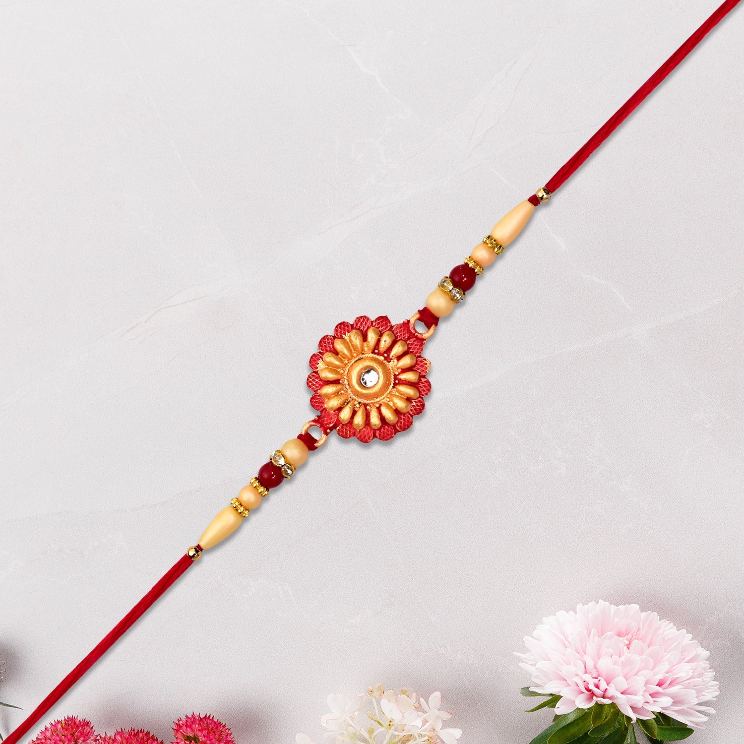 Floral Bead Rakhi With Central Stone Wukusy