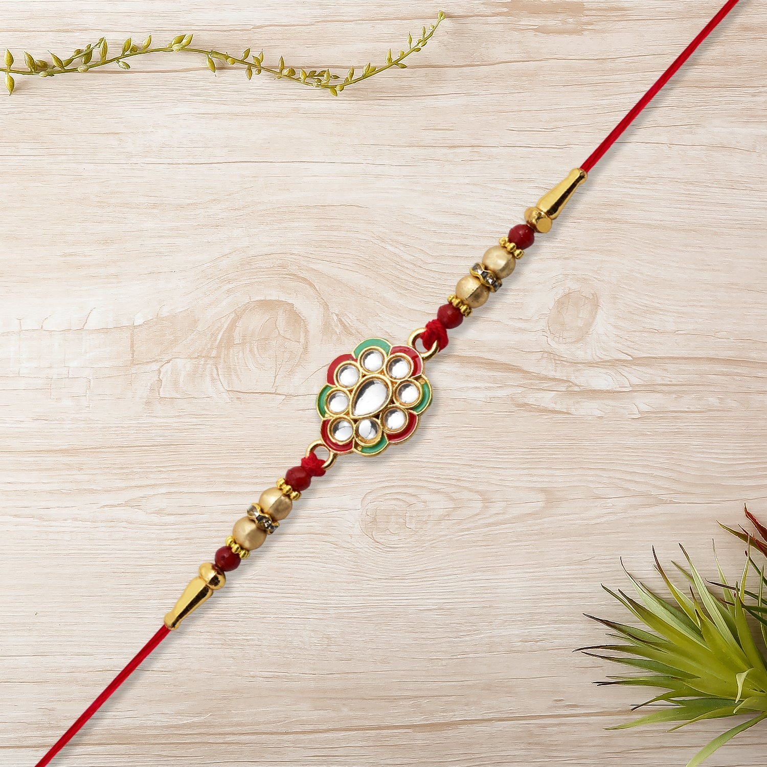 Kundan Work Floral Rakhi With Red Thread Wukusy