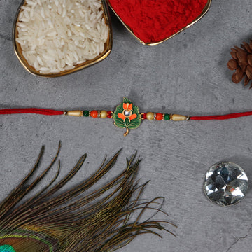 Green Tulsi Leaf Rakhi With Orange Enamel Flower And Beaded Thread Wukusy