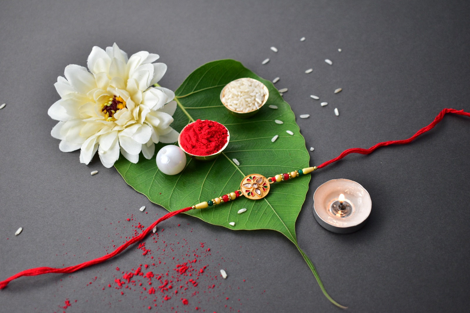 Sacred Kalash Design Rakhi With Embellished Beads And Red Thread Wukusy