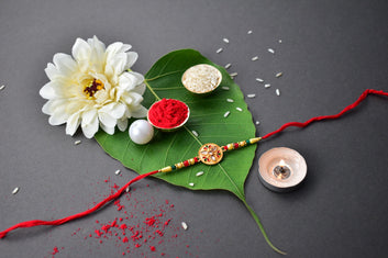 Sacred Kalash Design Rakhi With Embellished Beads And Red Thread