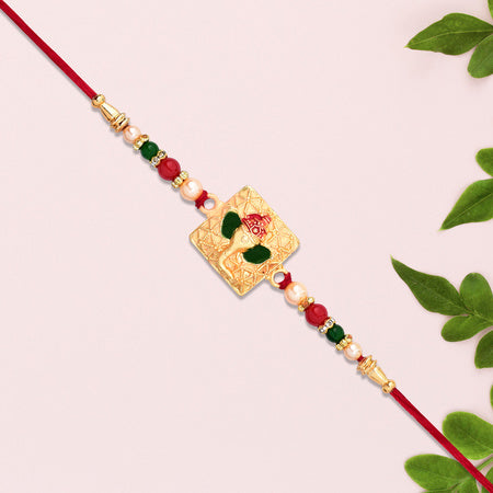 Golden Ganpati Rakhi With Red-green Beads And Enamel Detailing Wukusy