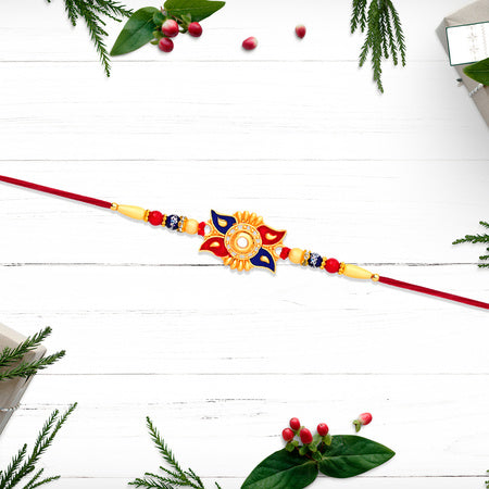 Designer Sun Motif Rakhi With Red And Blue Enamel Work Wukusy