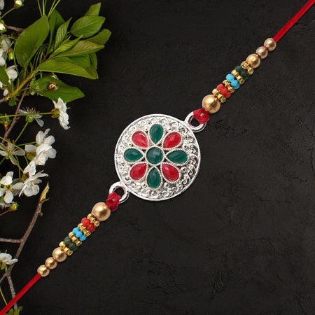 Silver Plated Floral Rakhi With Red  Green Stones Wukusy