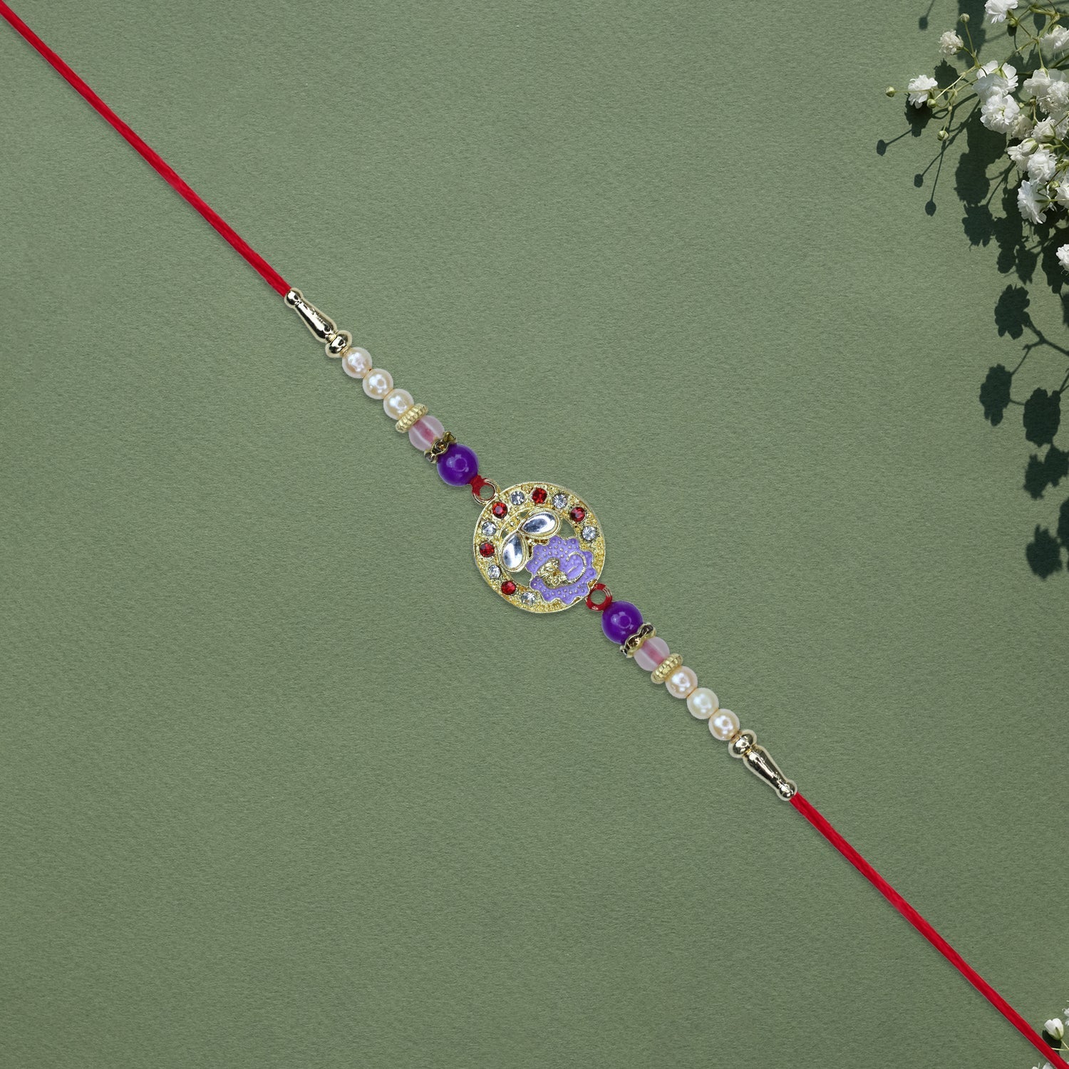 Elegant Ganesh Rakhi With Pearl And Purple Beads Wukusy