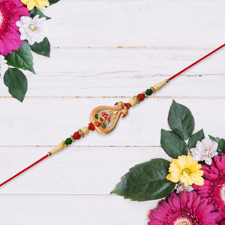 Designer Rakhi With Veena And Flower Charm Wukusy