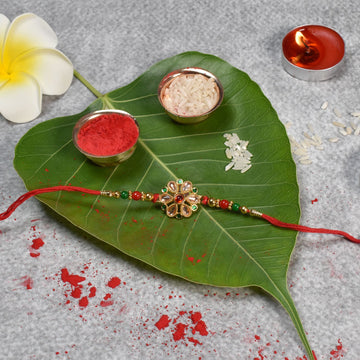 Floral Kundan Rakhi With Red-green Beads And Golden Finish Wukusy