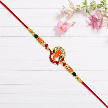 Golden Ganesha Rakhi With Red-green Beads And Stone Detailing Wukusy