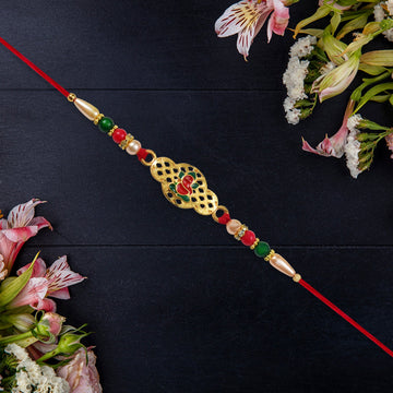 Religious Ganesha Rakhi In Gold Finish Wukusy