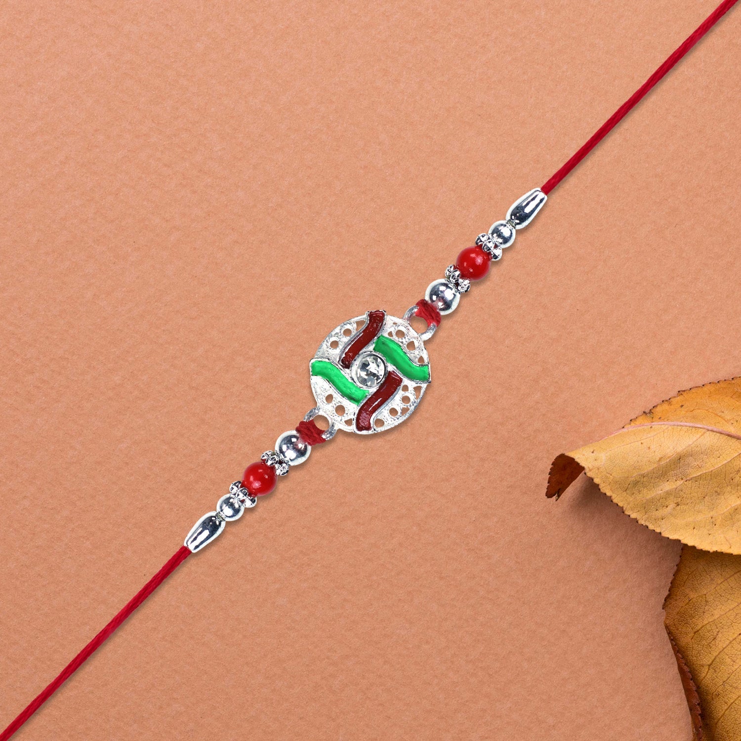 Silver-tone Swastik Rakhi Wukusy