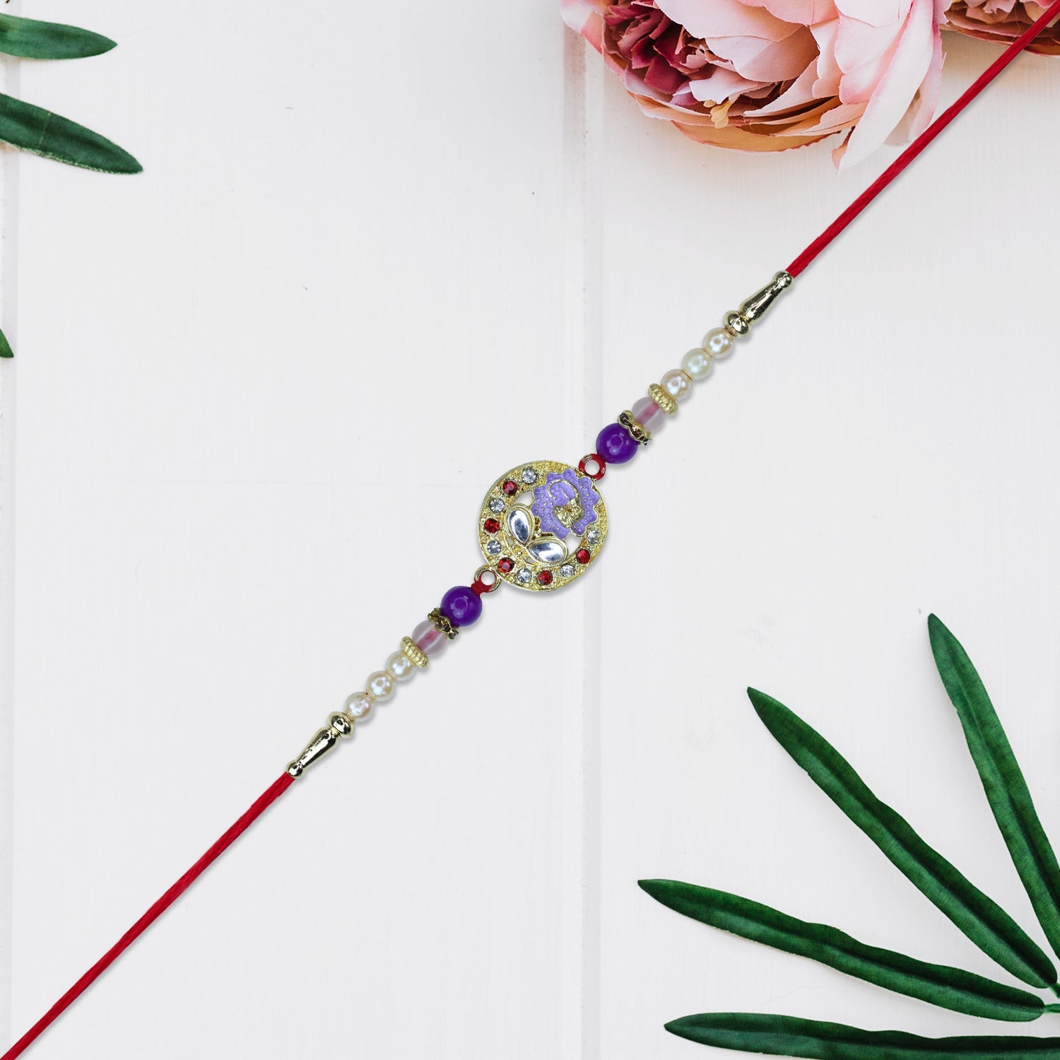 Elegant Ganesh Rakhi With Pearl And Purple Beads Wukusy