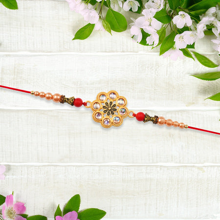 Gold-toned Floral Rakhi With Pink Stones Wukusy