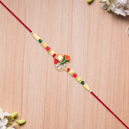 Divine Ganpati Rakhi With Enamel Work And Traditional Beads Wukusy